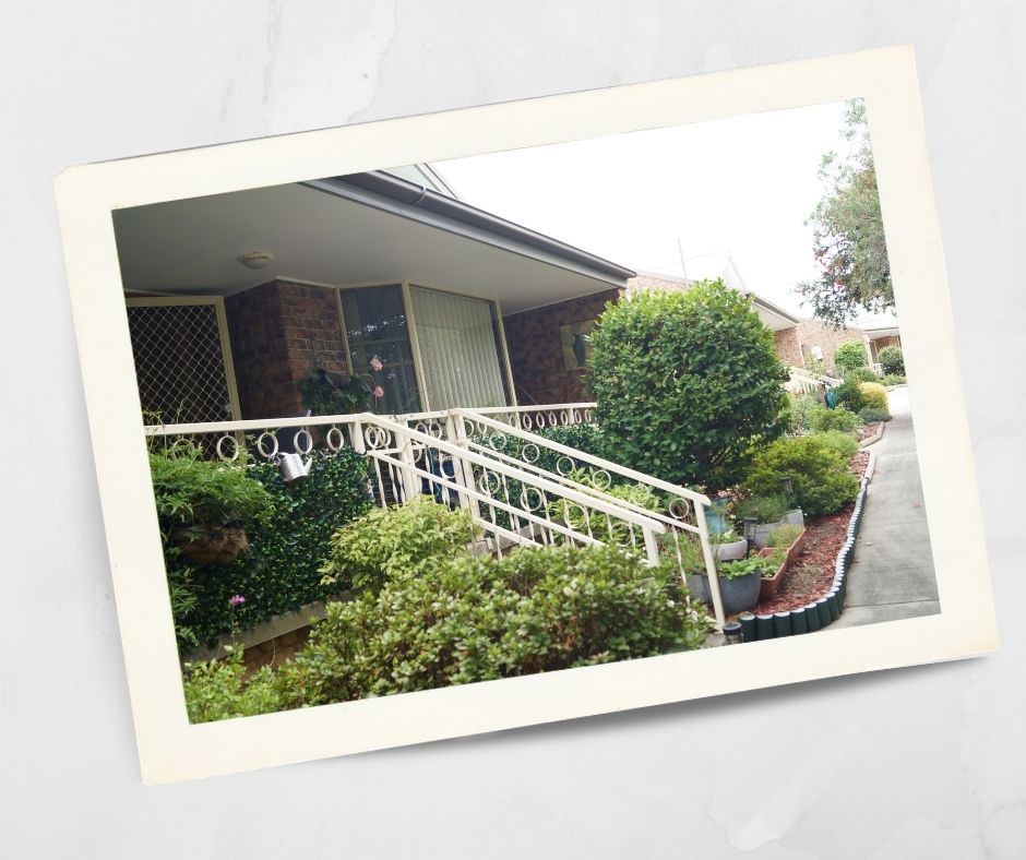 Single storey brick unit with accessible ramp and landscaped garden at Kirkley Gardens retirement village in Lithgow.