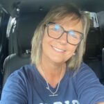 Janelle, local owner of Kirkley Gardens, smiling in a car, representing the people behind the independent living retirement village in Lithgow NSW