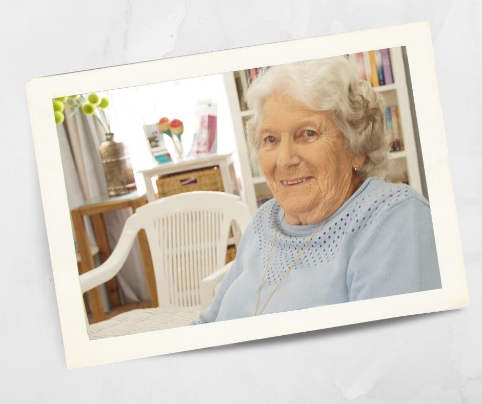 Kirkley Gardens resident sitting comfortably indoors in a bright, homely living space.